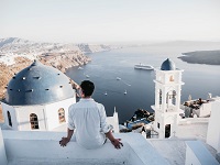 man sitting in santorini